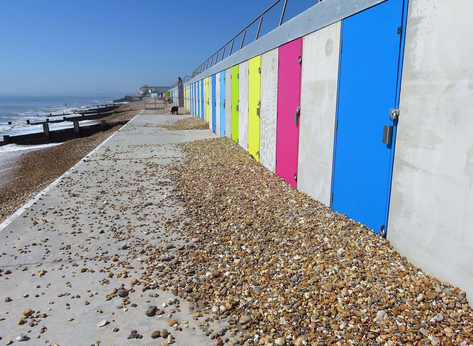 A row of brightly painted beach huts along the promenade at Milford on Sea